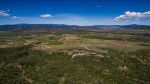 Birds eye view of property featuring a rural view and a mountain view