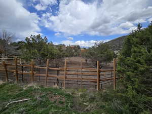 View of gate with a mountain view and fence