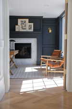 Sitting room with a glass covered fireplace