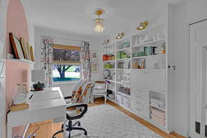 3rd bedroom on main level with built ins being used as office