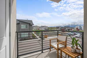 Balcony featuring a mountain view and a residential view
