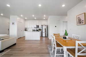 Dining area featuring recessed lighting, and light wood-style floor