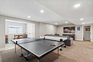 Playroom with baseboards, recessed lighting, and light carpet