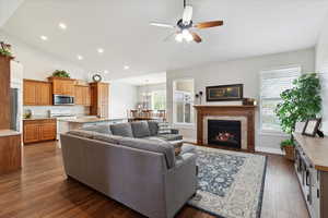 vaulted ceilings, custom cabinetry, cozy fireplace, and lots of natural light.