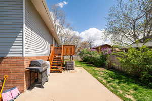 View of patio / terrace featuring a grill, a fenced backyard, and central AC unit