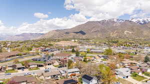 Birds eye view of property with a mountain view and a residential view