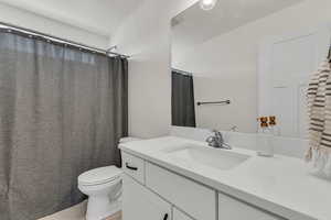 Bathroom with toilet and vanity