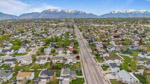 Birds eye view of property with a residential view and a mountain view