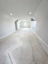 Bonus room with baseboards, recessed lighting, ceiling fan, and vaulted ceiling