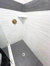 Bathroom featuring tiled shower