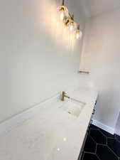 Bathroom with vanity and baseboards