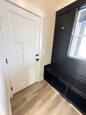 Mudroom with light wood-style flooring