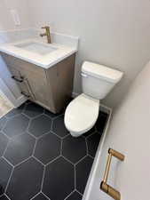 Bathroom featuring toilet and vanity