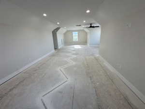 Bonus room featuring ceiling fan, recessed lighting, vaulted ceiling, and baseboards