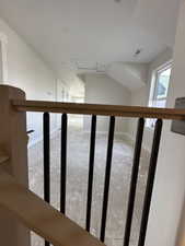 Stairway featuring carpet and baseboards