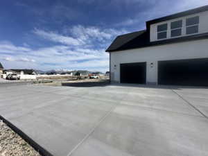 View of home's exterior featuring driveway and a garage