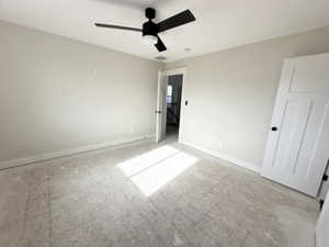 Unfurnished bedroom featuring ceiling fan and baseboards