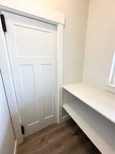 Mudroom featuring dark wood-style floors