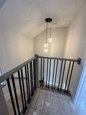 Staircase with lofted ceiling