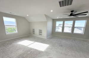 Bonus room with recessed lighting, visible vents, lofted ceiling, and baseboards