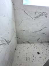 Bathroom with a tile shower