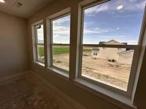 Entryway featuring visible vents and baseboards
