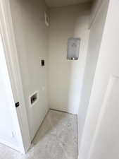 Clothes washing area featuring washer hookup and visible vents