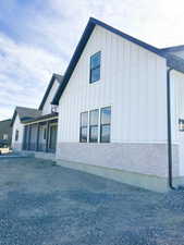 View of property exterior with board and batten siding