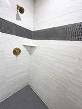 Full bath with tiled shower
