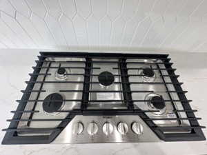 Interior details with stainless steel gas cooktop and stone countertops