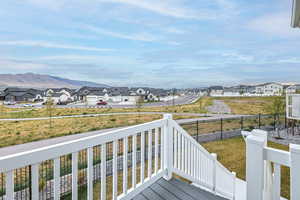 Wooden terrace with a mountain view and a residential view