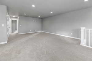 Spare room with baseboards, carpet flooring, and recessed lighting