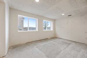 Unfurnished room with visible vents
