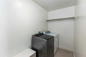 Laundry room featuring laundry area and washing machine and dryer