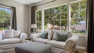 Living room featuring carpet and baseboards