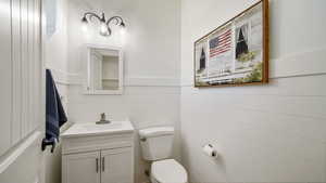 Half bath with toilet and vanity