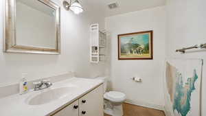 Bathroom with vanity and toilet