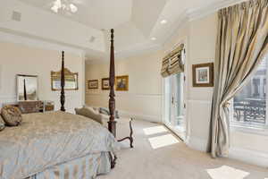 Bedroom with recessed lighting, a raised ceiling, visible vents, light carpet, and crown molding