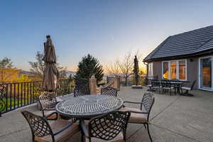 Patio terrace at dusk with outdoor dining area