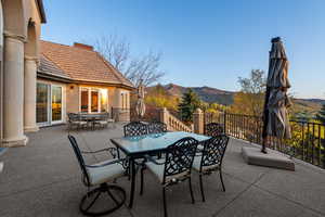 View of patio with outdoor dining area and a mountain view