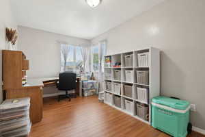 Office featuring baseboards and wood finished floors