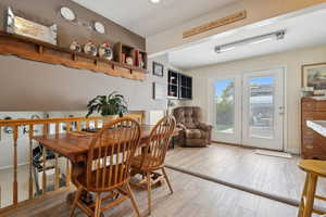 Dining space featuring baseboards and light wood-style floors