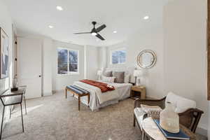 Primary bedroom with ceiling fan and mountain views. Includes double-vanity bathroom, walk-in closet, and extra storage closet.