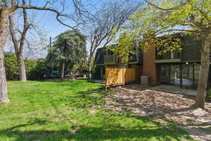 View of yard featuring a patio area and a balcony