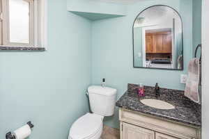 Bathroom with toilet and vanity