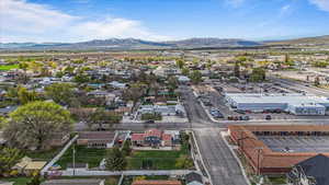 Birds eye view of property with a mountain view and a residential view