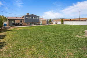 View of yard featuring a patio and fence