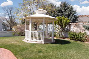 View of yard with a gazebo and fence