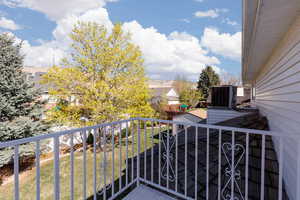 Balcony featuring central AC unit