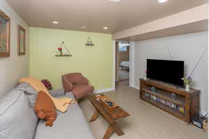 Living area featuring recessed lighting, wood finished floors, and baseboards